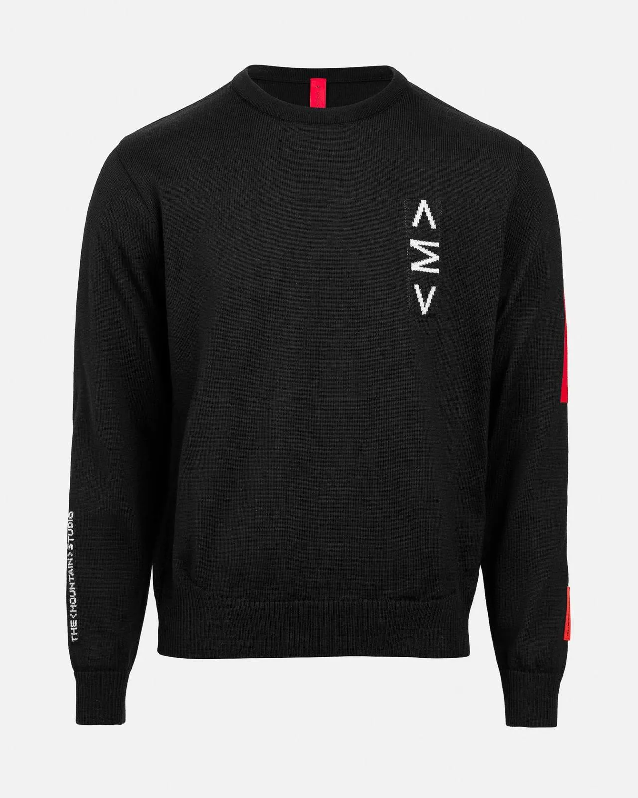 Black K-3 ski sweater with a round neckline, white intarsia pattern and red accents on the sleeves and collar.