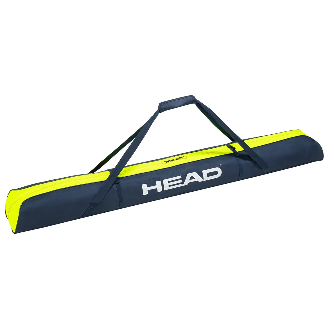 Sac à skis Head Single 175cm en bleu/jaune, avec sangles de transport, représenté couché.