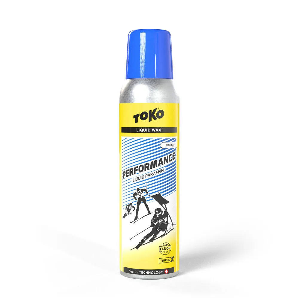 Aérosol argenté avec couvercle bleu, étiquette jaune avec "Toko Performance Liquid Paraffin" et motif de skieur.