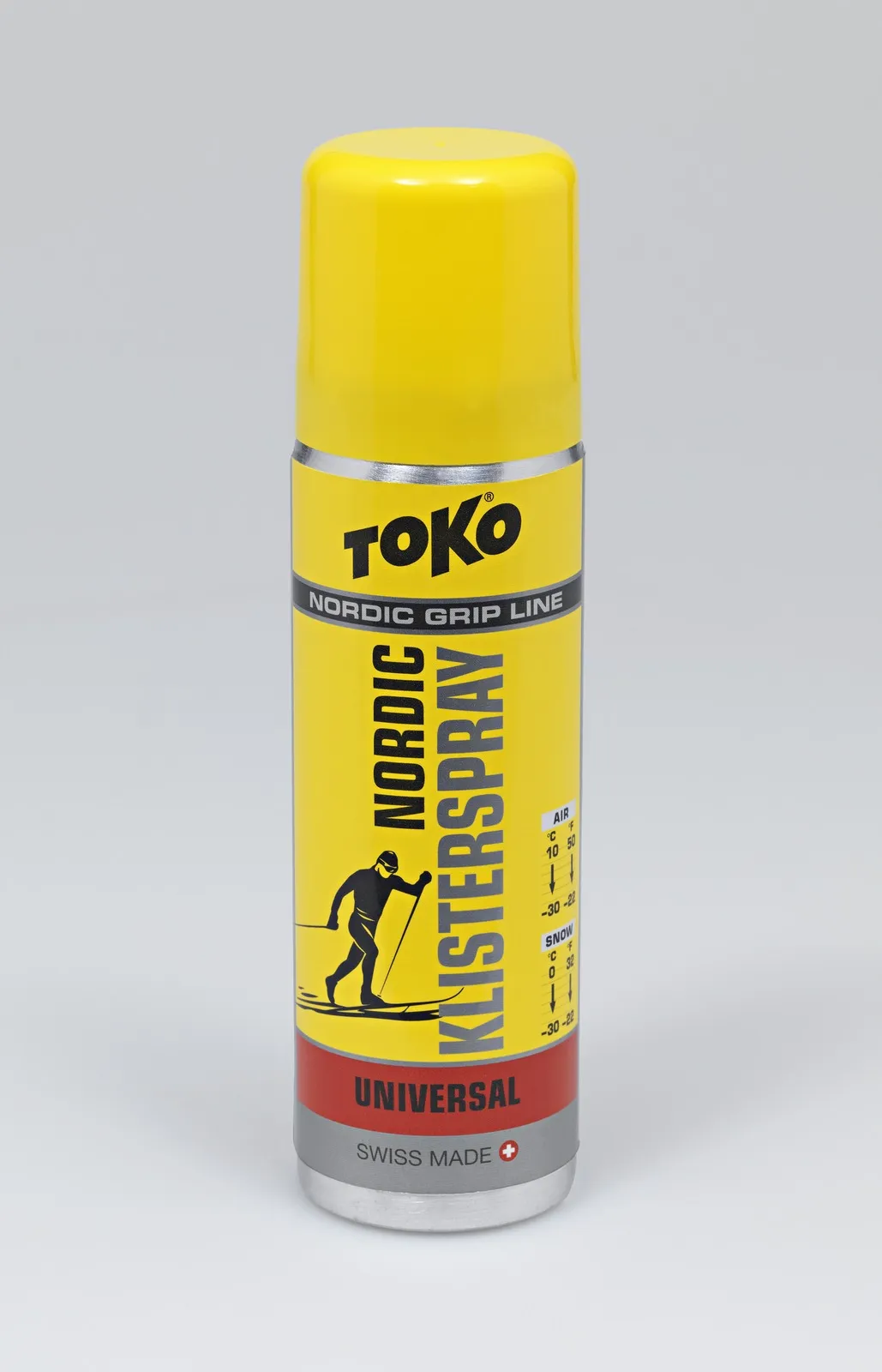 Gelbe Spraydose Toko Nordic KlisterSpray Universal mit Skifahrer-Illustration und Temperaturbereich.