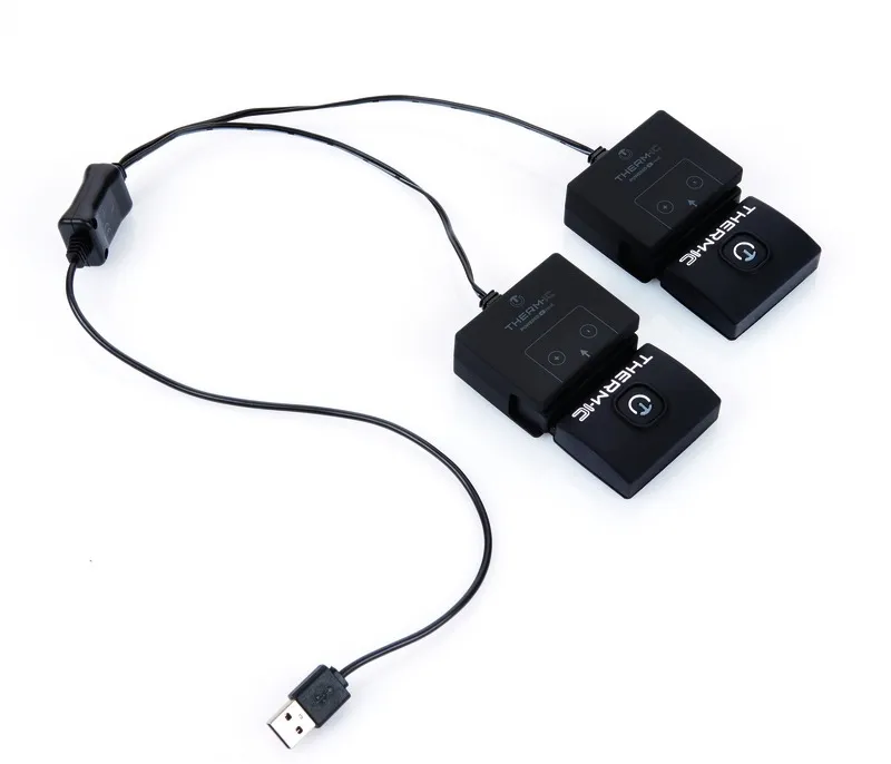 Chargeur USB noir pour batteries S-Pack avec deux connecteurs et une prise USB.