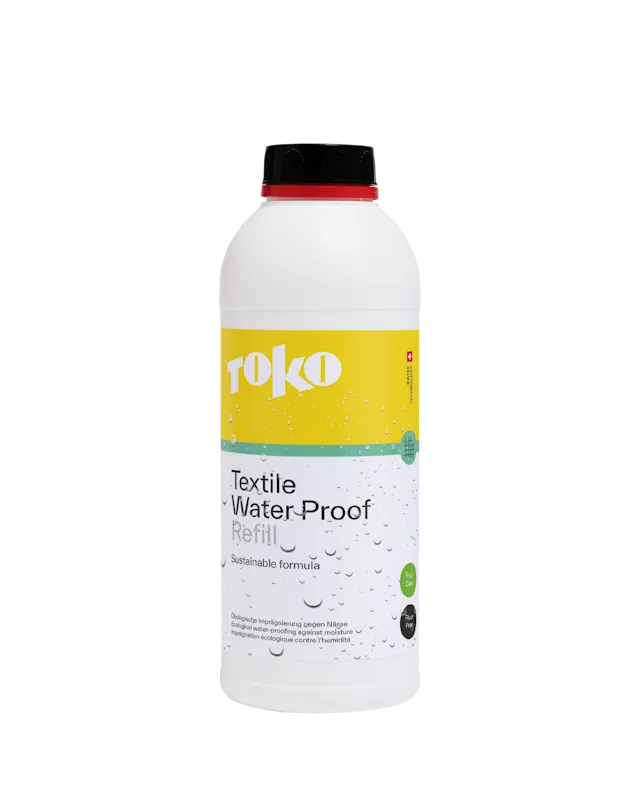 White bottle "TOKO Textile Water Proof Refill" with yellow label and water droplets, black lid.