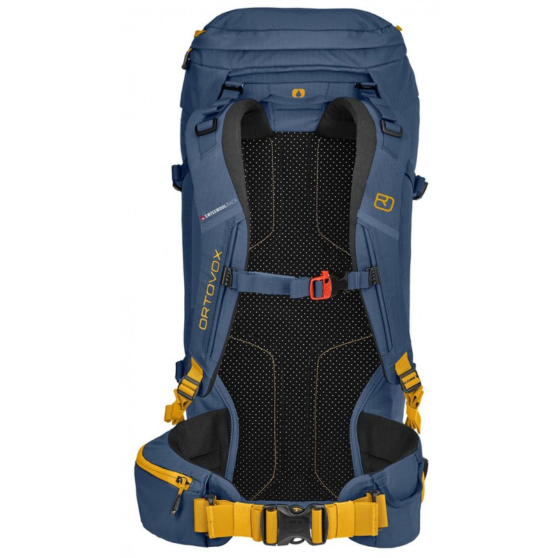 Blauer Ortovox Peak 35 Rucksack, Rückansicht mit gelben Akzenten und atmungsaktivem Rückenteil.