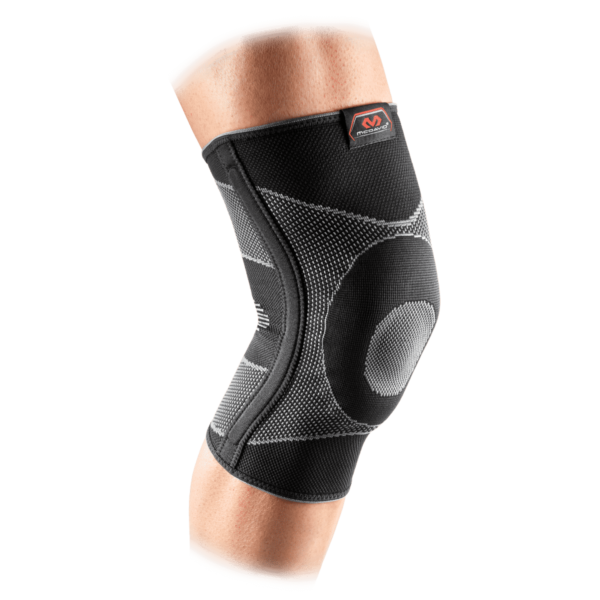 Knee with black, elastic McDavid knee support, with gray details and red logo.