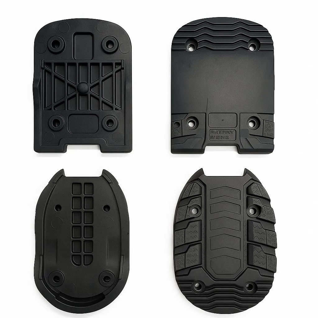 Four black, textured soles of ski touring bindings, shown from different perspectives on a white background.