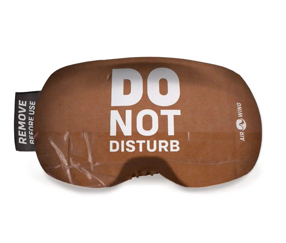 Airwing Disturb ski goggle protection cover with the inscription "Do Not Disturb" and instructions for removal before use.