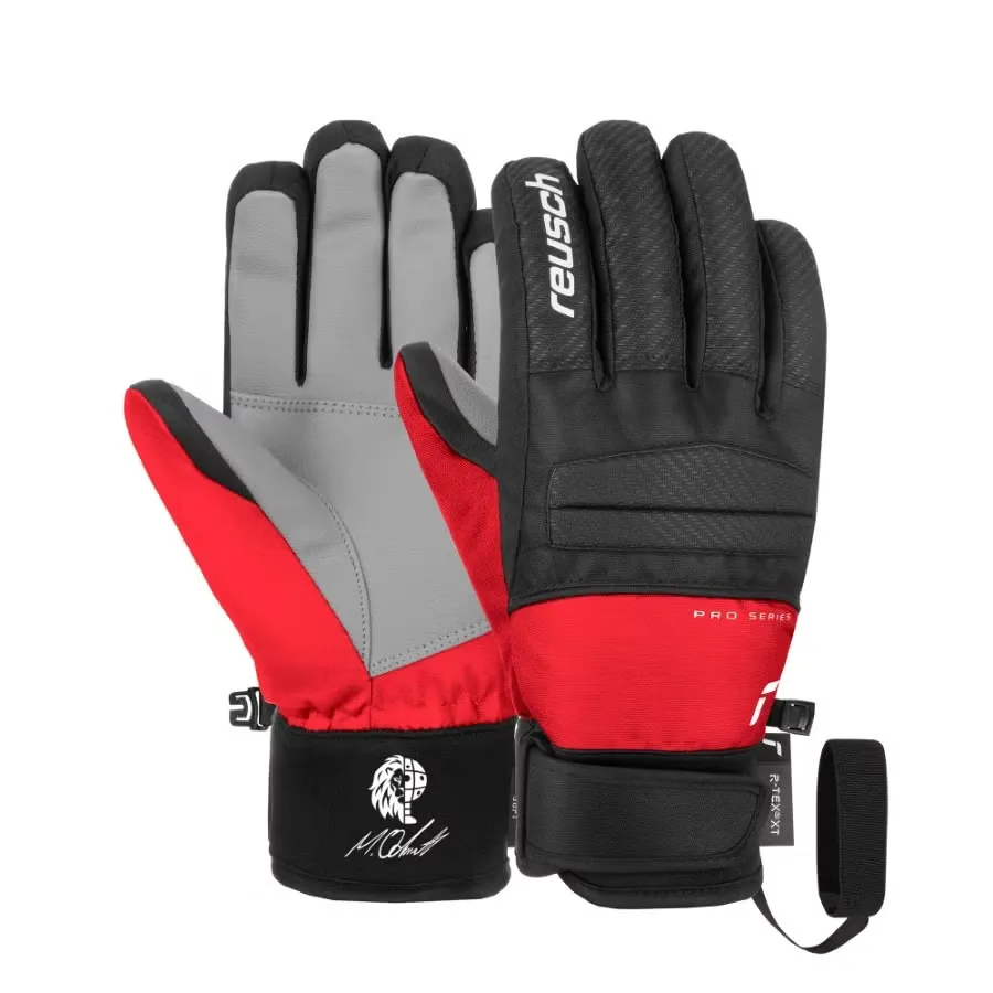 Two Reusch Warrior R-TEX XT Junior ski gloves in red, black and gray.