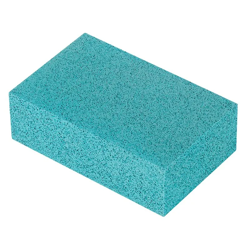 A rectangular, turquoise pumice block with a porous texture on a white background.