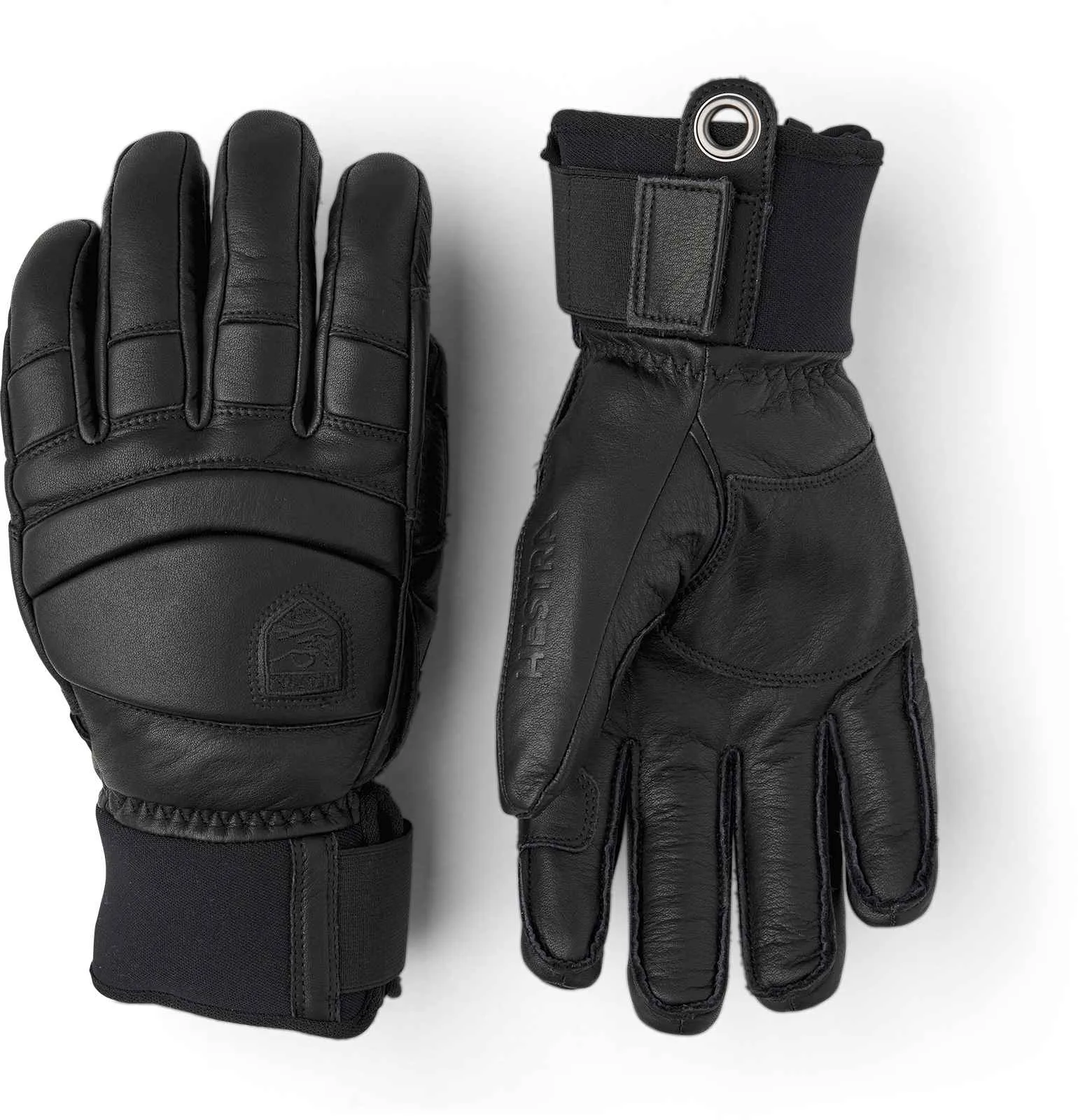 Zwei schwarze Hestra Fall Line Lederhandschuhe liegen auf einem weißen Hintergrund.