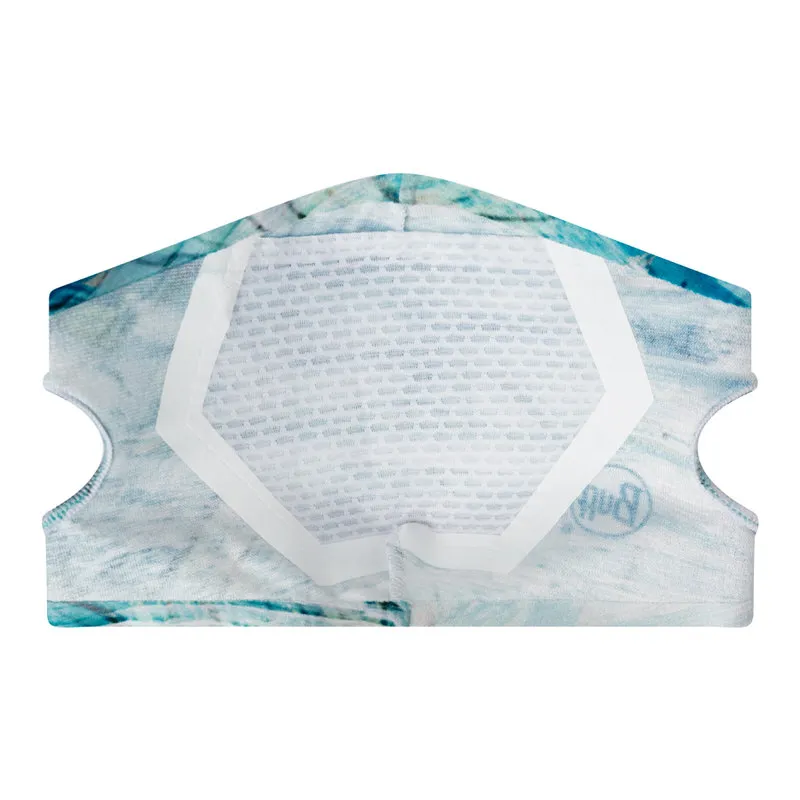 Gros plan sur l'intérieur d'un masque filtrant bleu Buff avec l'élément filtrant visible.
