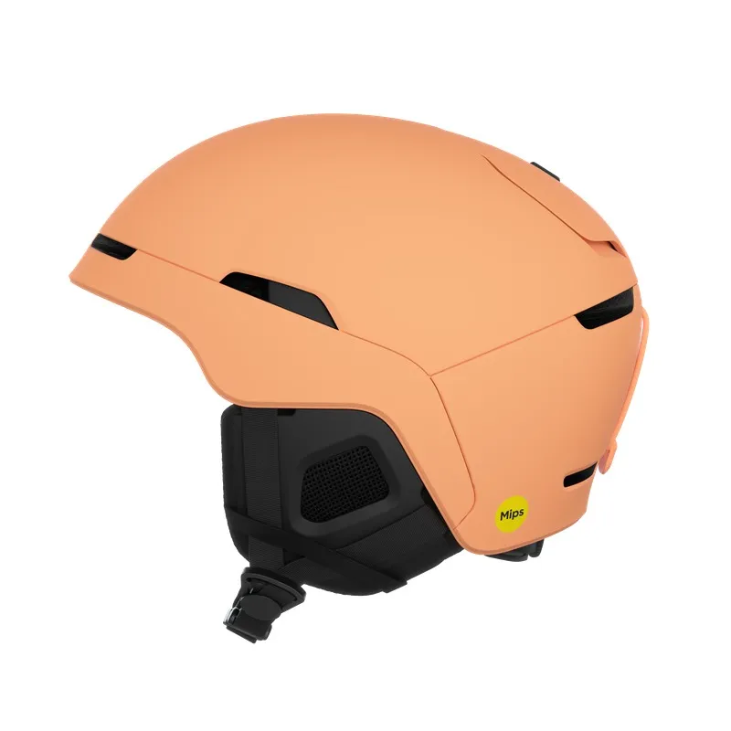 Peach-colored ski helmet with black accents and a yellow MIPS sticker.