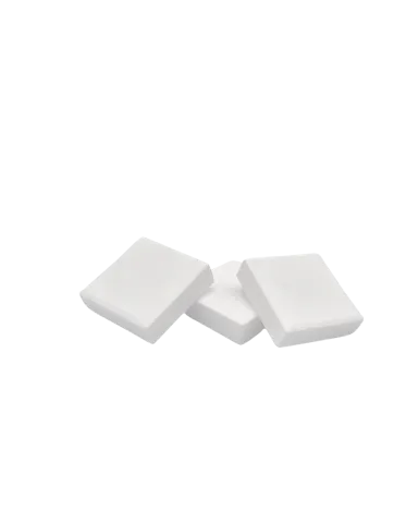 Three white, square tablets on top of each other, slightly offset on a white background.
