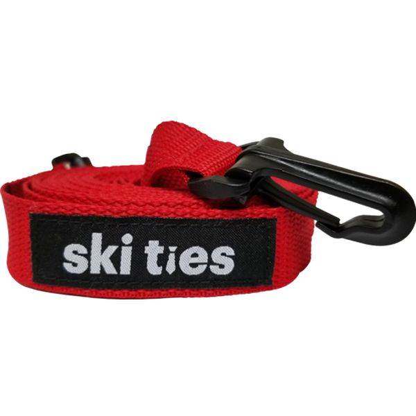 Laisse de ski enroulée rouge Ski Ties pour enfants avec mousqueton noir et logo.