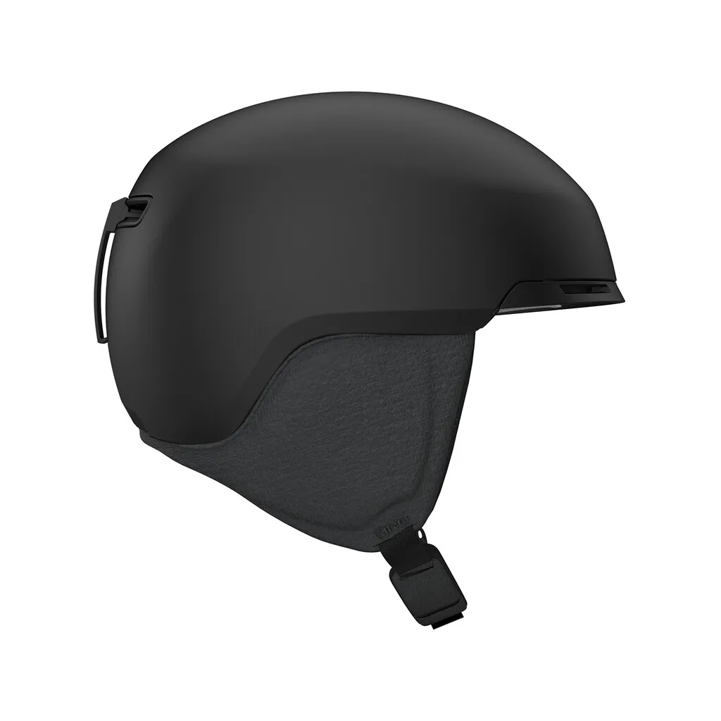 Matt black Giro Tagert MIPS ski helmet, side view. Details of ear pads and chin strap visible.