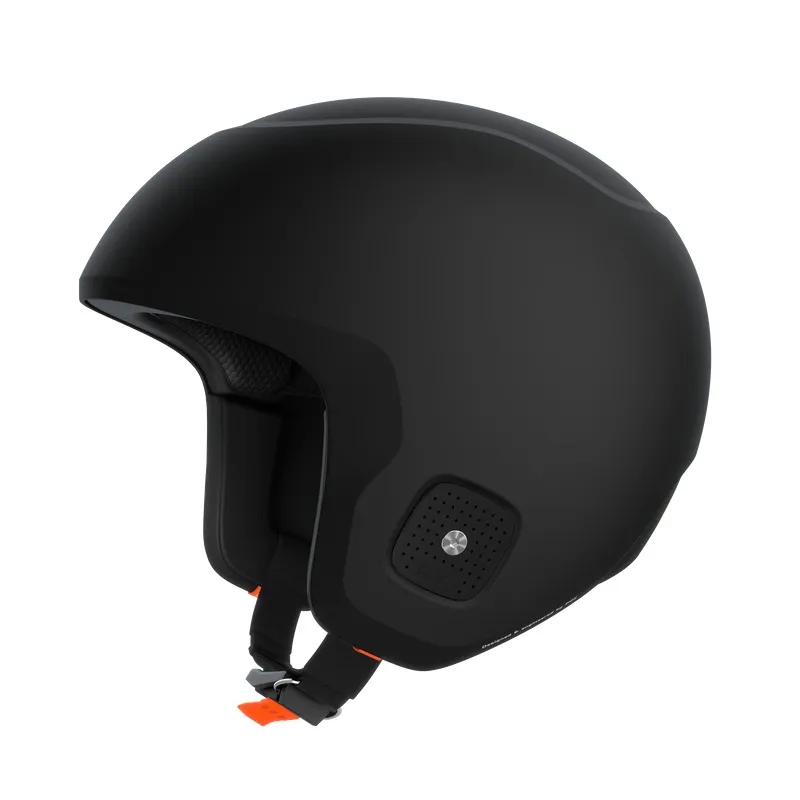 Black ski helmet with chin strap and orange accents, insulated against a white background.