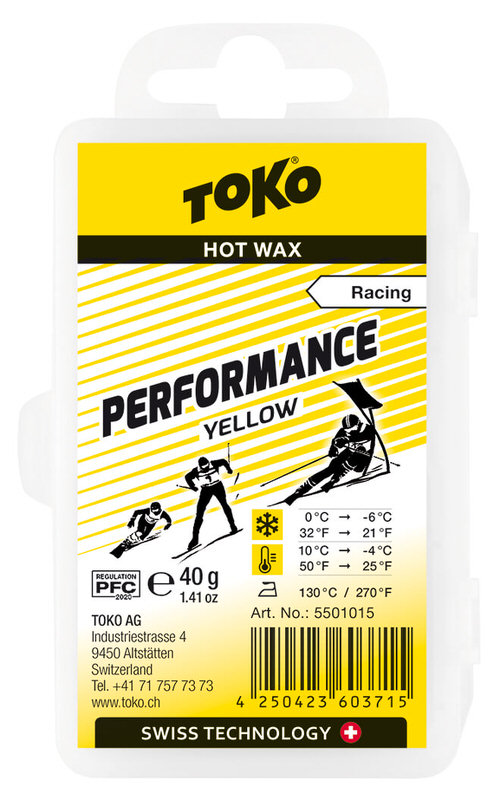 Verpackung Toko Performance yellow Heisswax für Rennen, mit Skifahrer-Illustrationen. Temperatur-Infos und Logo.