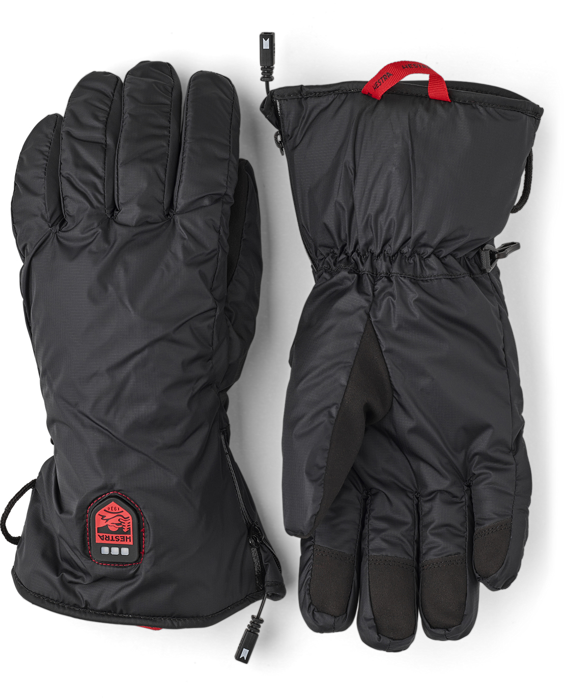 Une paire de gants chauffants noirs Hestra, un sur le côté gauche, l'autre sur le côté droit.