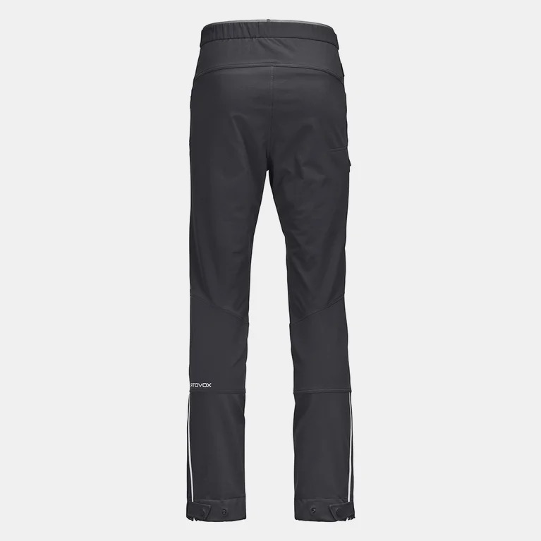 Schwarze Ortovox COL BECCHEI Pants für Herren, Rückansicht, mit weißem Logo und Streifen am Bein.