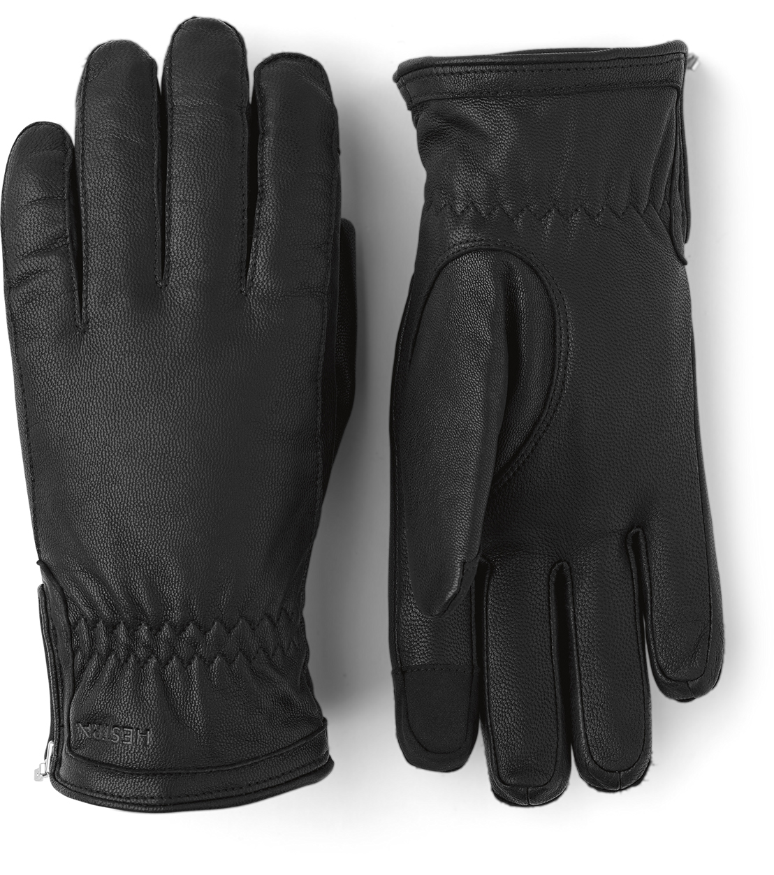 Zwei schwarze Lederhandschuhe, einer mit der Handfläche nach oben und einer mit dem Handrücken.
