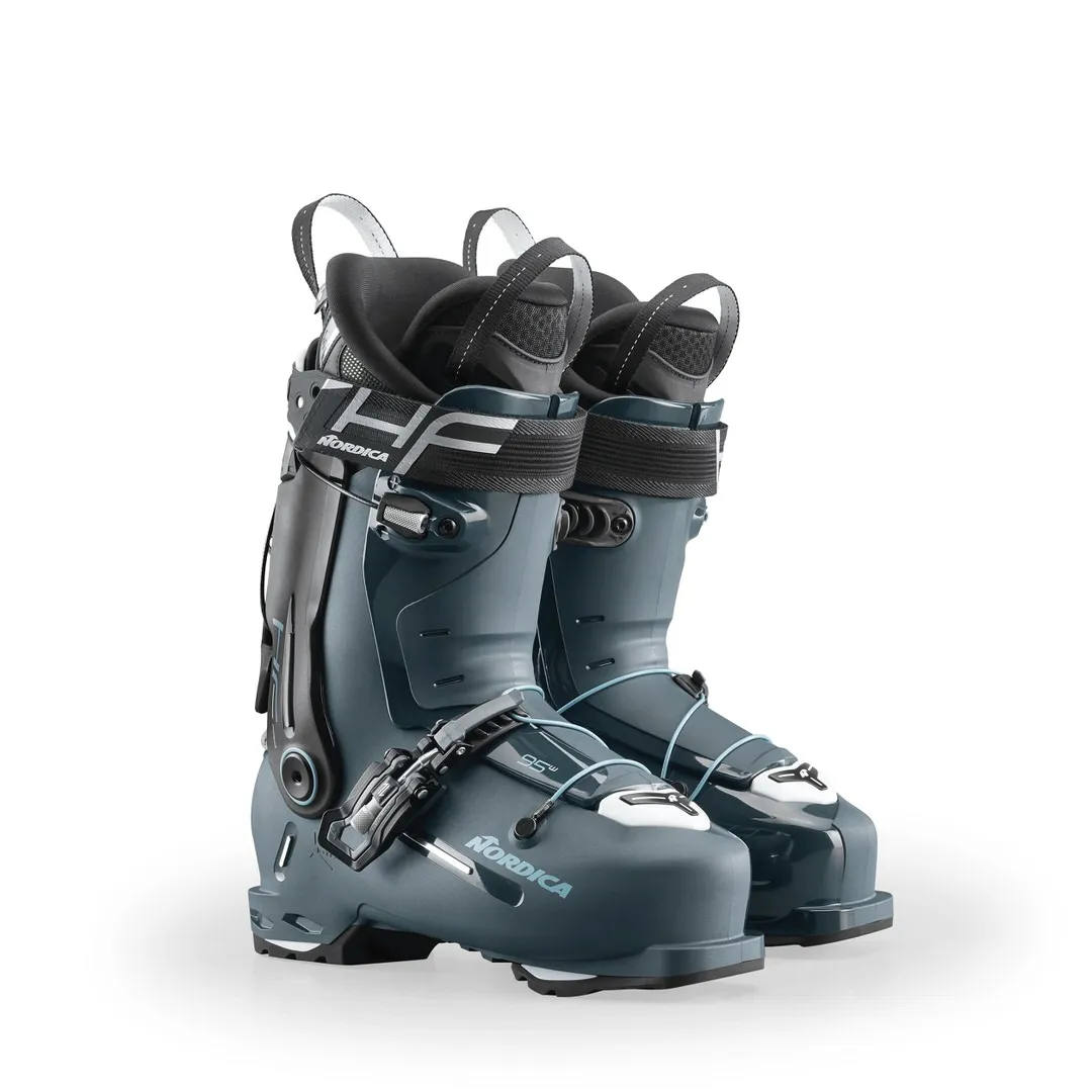 Two gray Nordica HF Pro 95 W GW ski boots stand upright against a white background. Details: buckles, straps and pull tabs.