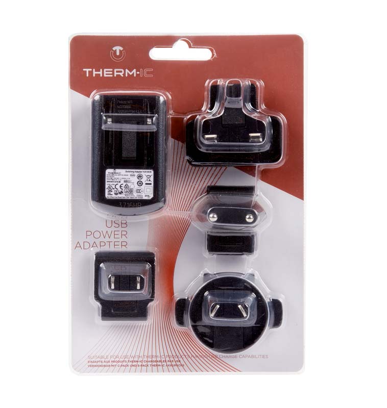 Therm-ic USB Power Adapter in Verpackung mit Länderadapteraufsätzen.