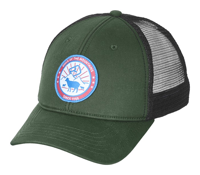 Green trucker cap with mesh insert and round patch with sheep and mountains.
