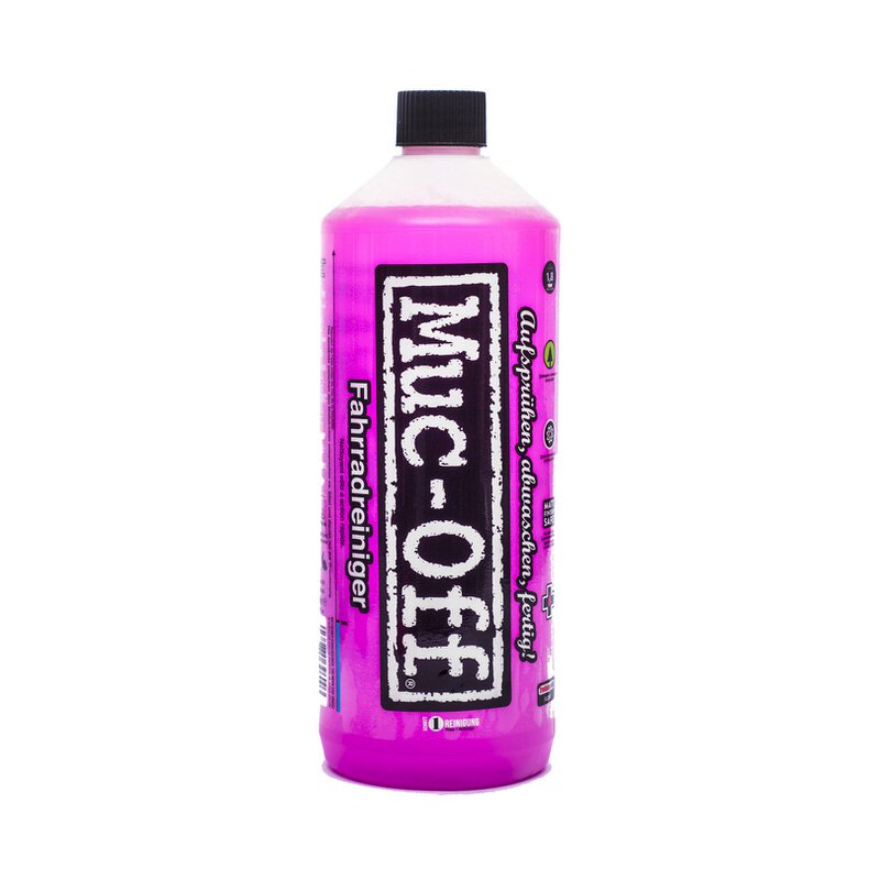 Bouteille Muc-Off Nettoyant pour vélo Nano Tech en rose. Texte sur la bouteille : "Vaporiser, rincer, c'est prêt !" et "Nettoyant pour vélo".