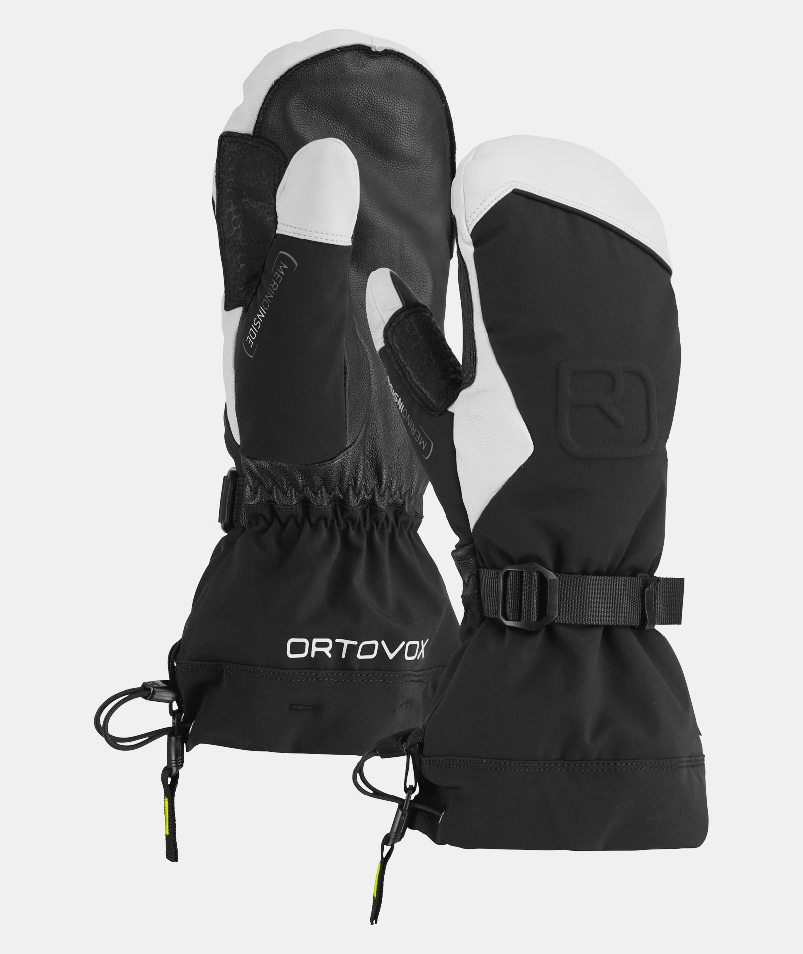 Zwei Ortovox Merino Freeride Fäustlinge in Schwarz und Weiß, mit Gurt und Kordelzug.