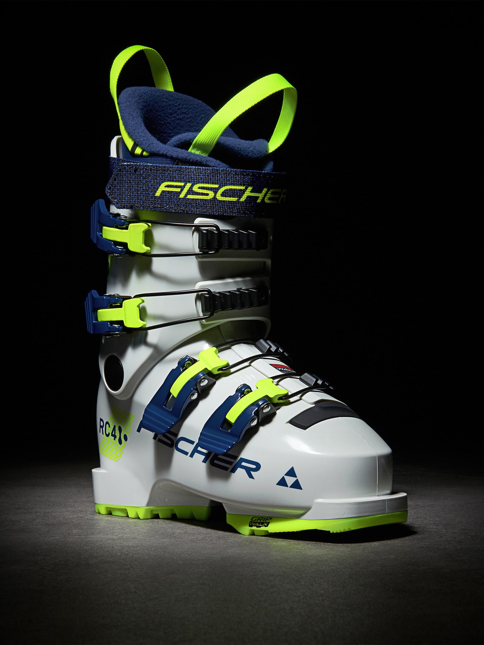 Chaussure de ski blanche Fischer RC4 60 JR avec accents bleus et jaunes fluo, vue latérale.