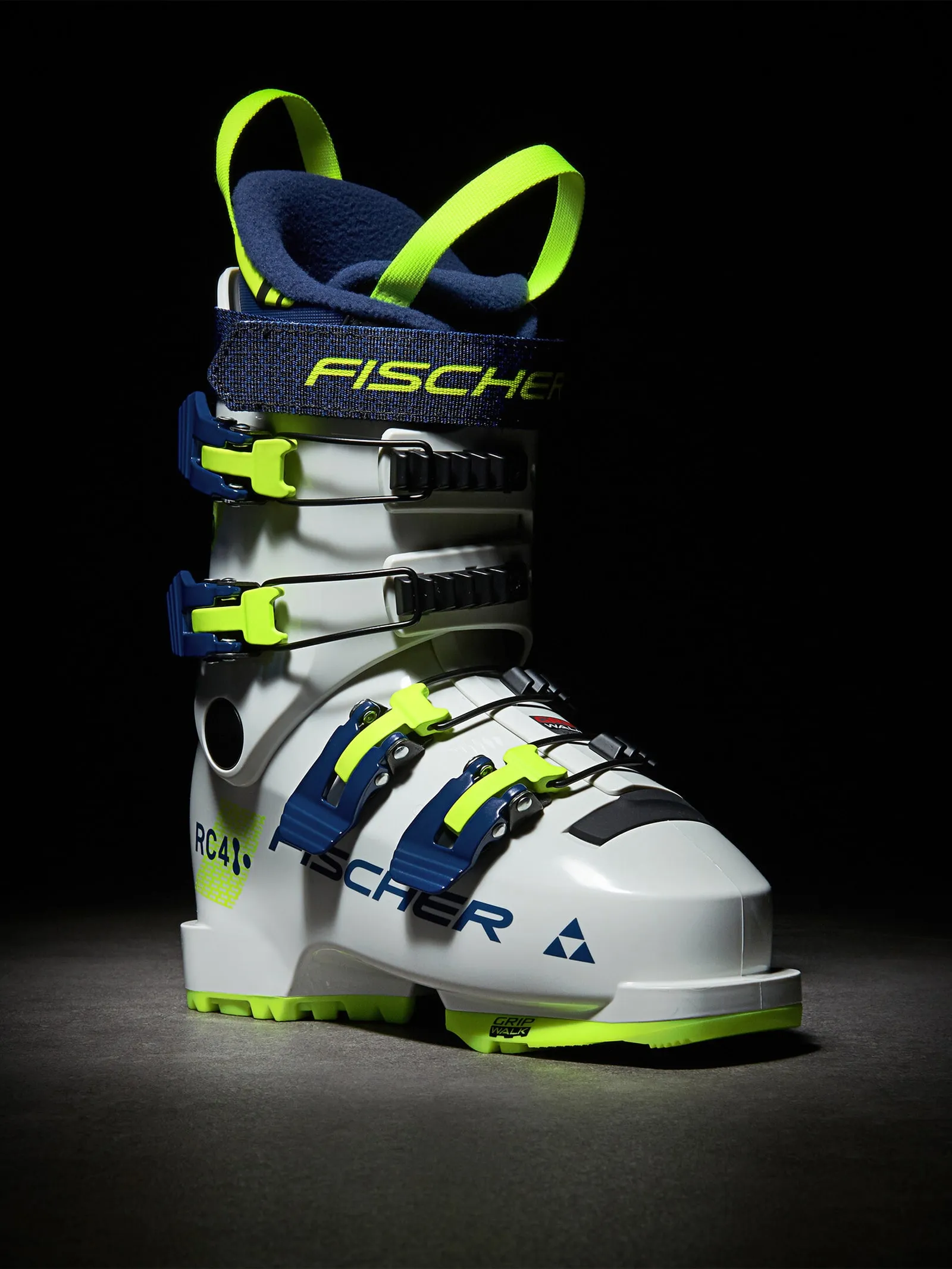 Chaussure de ski blanche Fischer RC4 60 JR avec accents bleus et jaunes fluo, vue latérale.