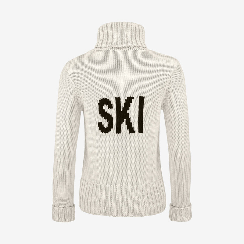Pull blanc Rebels Coco pour femme avec col roulé et l'inscription noire "SKI" dans le dos.
