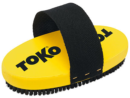 Gelbe, ovale Toko Bürste mit schwarzem Pferdehaar und Halteband.