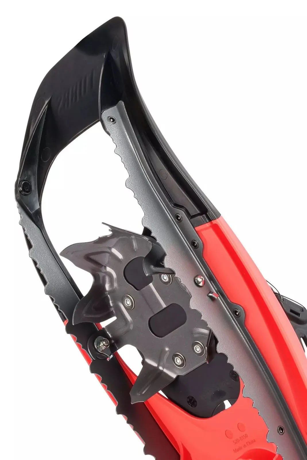 Close-up of a Tubbs VRT 21 women's Coral snowshoe with spikes for grip in the snow.