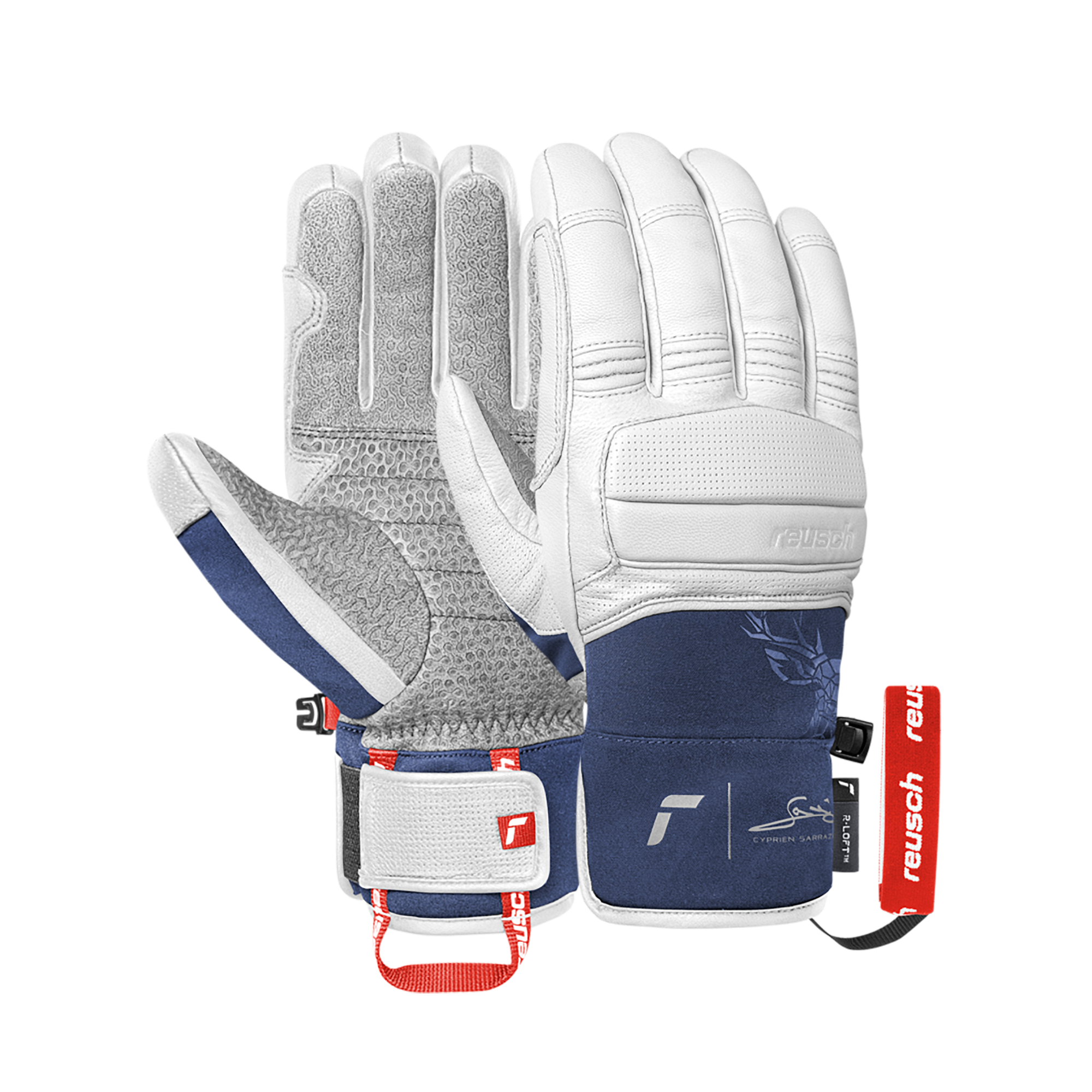 Deux gants de ski de Reusch, cuir blanc avec des accents bleu foncé et un motif floral, se trouvent sur un fond blanc.