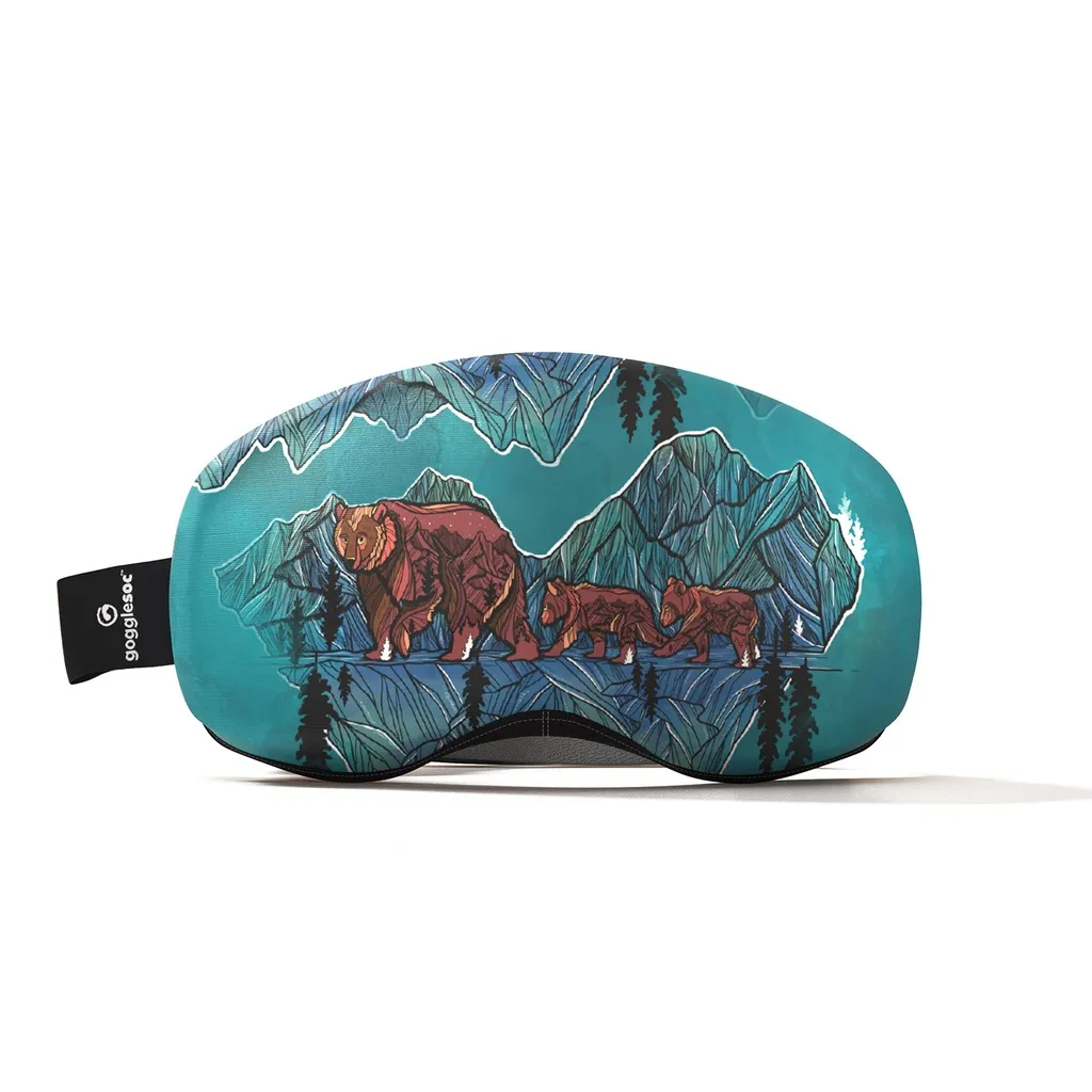 Gogglesoc Pro with bear family against a mountain backdrop in shades of blue and brown. Elastic protection for ski goggles.