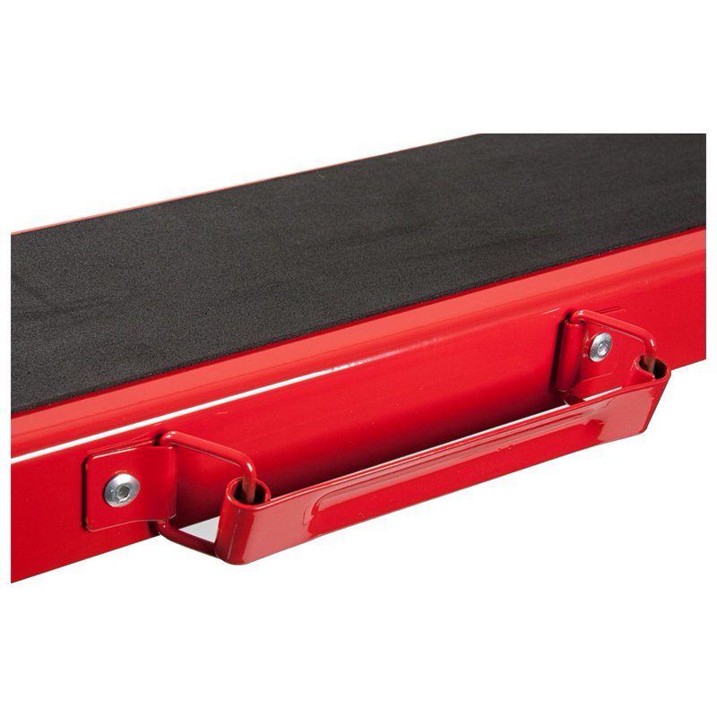Detailed view of a red Vola Racing transport waxing table with black surface and carrying handle.