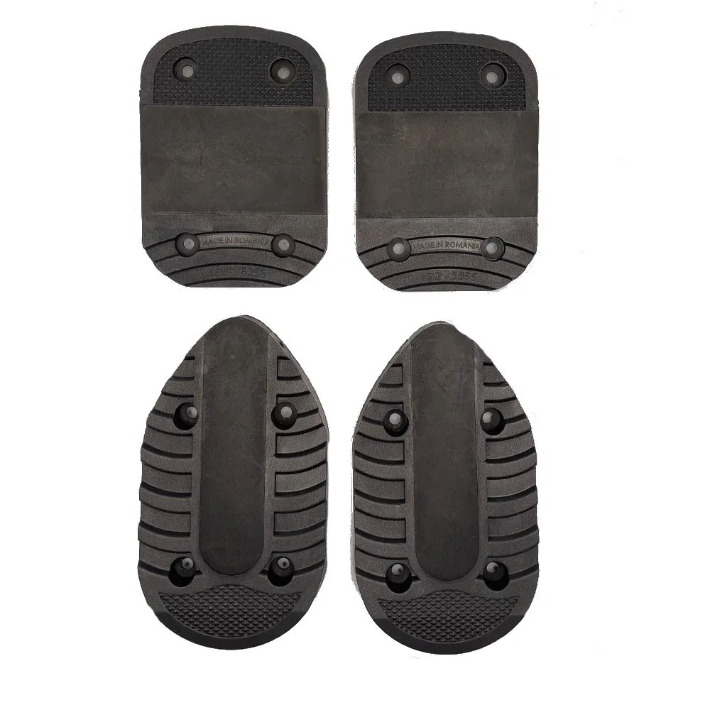 Four black Lange RX/LX Alpine replacement soles, two heel and two toe plates, insulated on a white background.