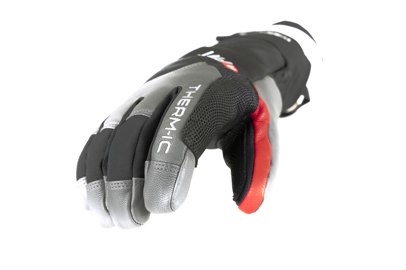 Guanto Therm-ic Freeride Primo piano di un guanto Therm-ic Freeride Extra Warm, palmo in giù, grigio, nero e accenti rossi.