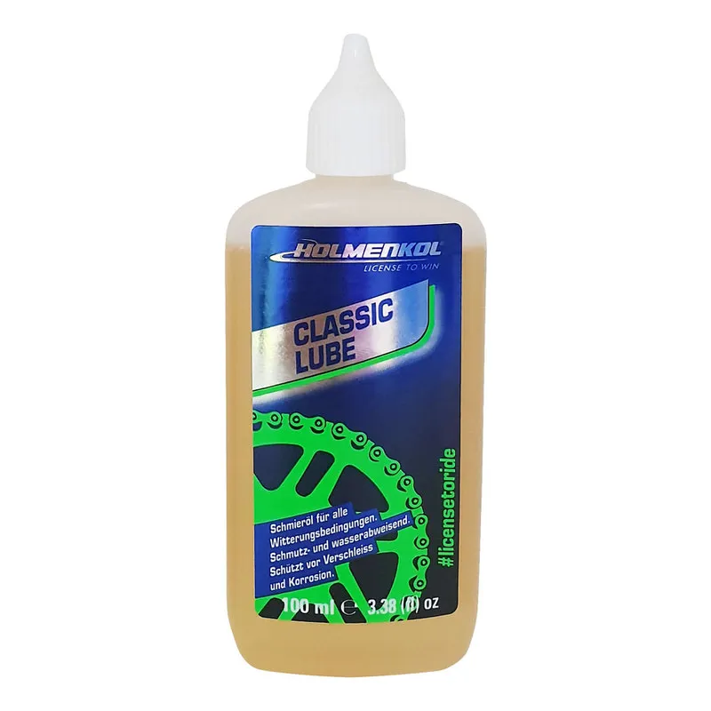 Flasche Holmenkol Classic Lube Kettenöl, hellbraune Flüssigkeit, blau-grünes Etikett mit Ketten-Grafik.