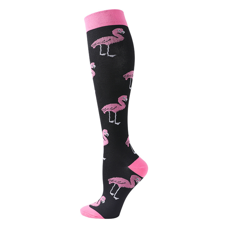 Flamingo ski sock black A black ski sock with pink flamingos, cuffs and toes.