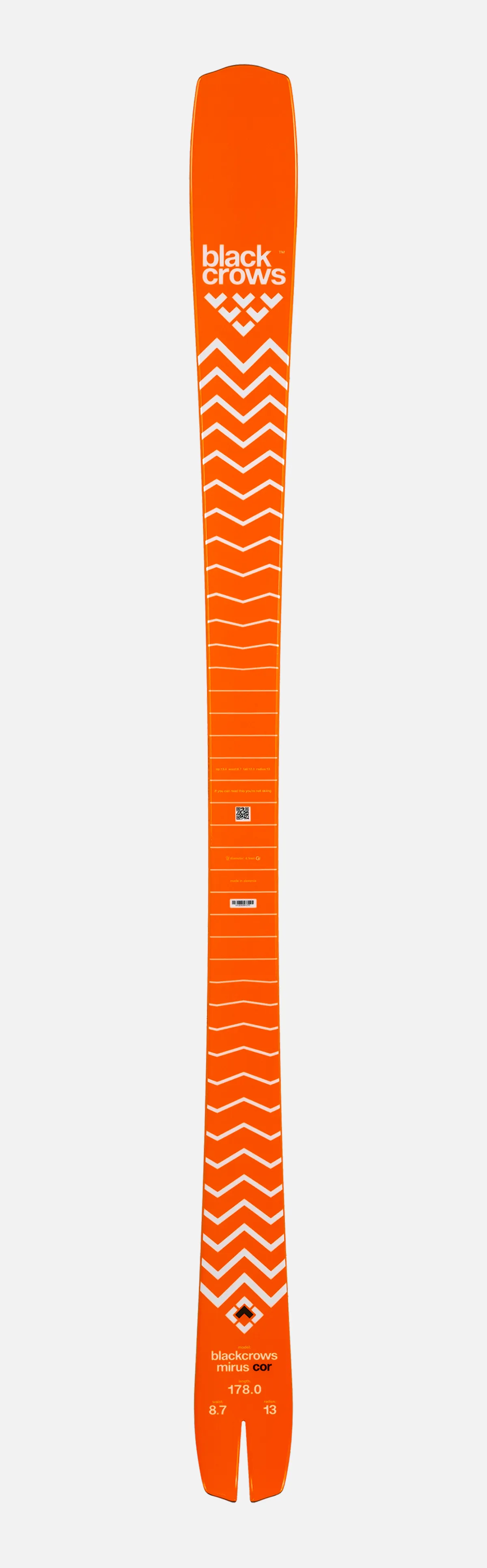 An orange ski with a white zigzag pattern, the Black Crows logo and technical details on a white background.