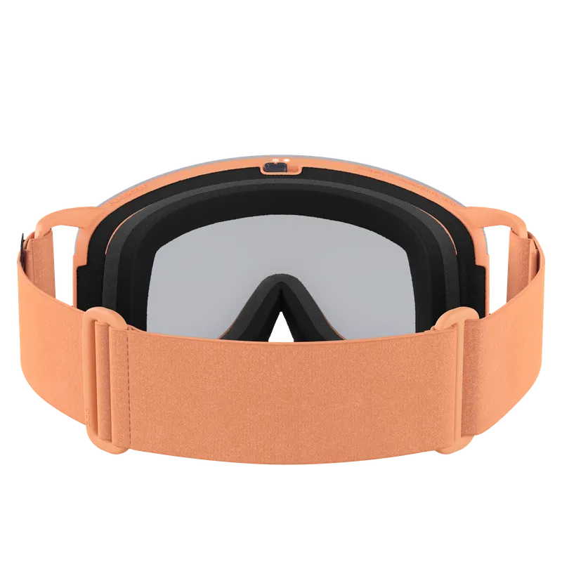 Ski or snowboard goggles in peach color with grey tinted lens and adjustable strap.