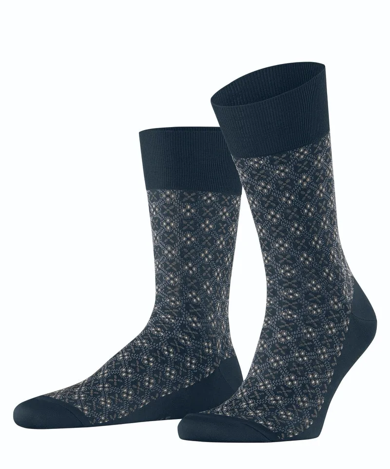 Two Falke men's socks, "Deepsea" blue with pattern, slightly offset to the side.