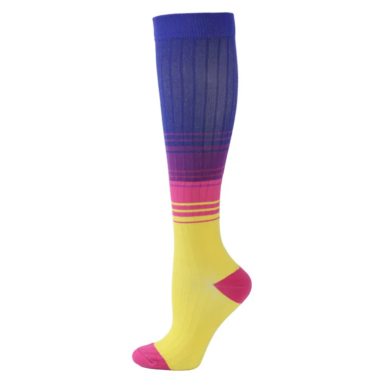 Knee-high socks in rainbow colors: Blue, purple, pink, yellow with pink toe and heel area.