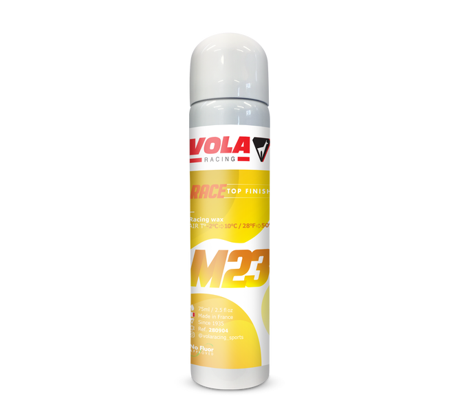 Bombe aérosol blanche et jaune Vola M23 Race Top Finish pour skis, avec logo du fabricant et informations sur le produit.