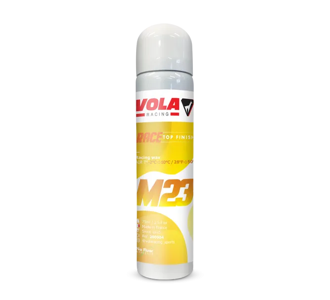 Bombe aérosol blanche et jaune Vola M23 Race Top Finish pour skis, avec logo du fabricant et informations sur le produit.