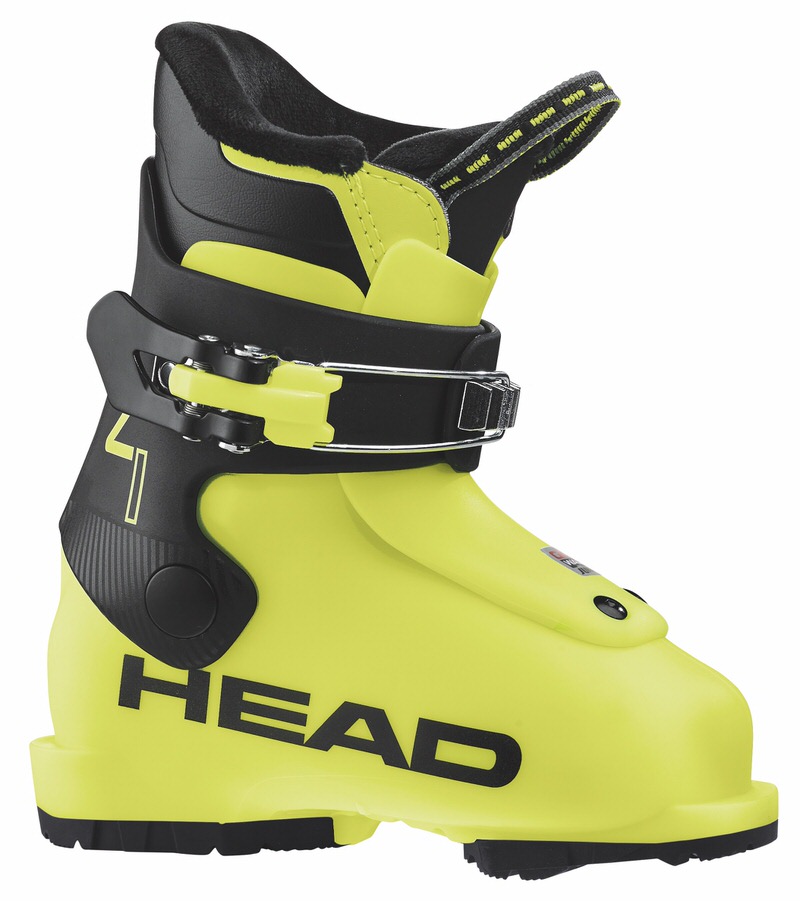 Gelber Kinderskischuh Head Z1 mit schwarzem Verschluss und Aufschrift "HEAD". Der Innenschuh ist schwarz mit gelben Akzenten.