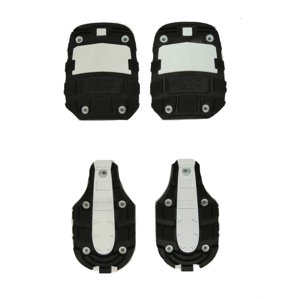 Vier schwarze HEAD GripWalk Kit GW KORE Sohlen, zwei für die Ferse und zwei für die Spitze, auf weißem Grund.
