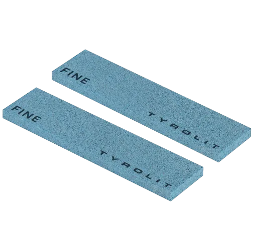 Two light blue, rectangular whetstones with the inscriptions "FINE" and "Tyrolit" lie parallel to each other on a white background.