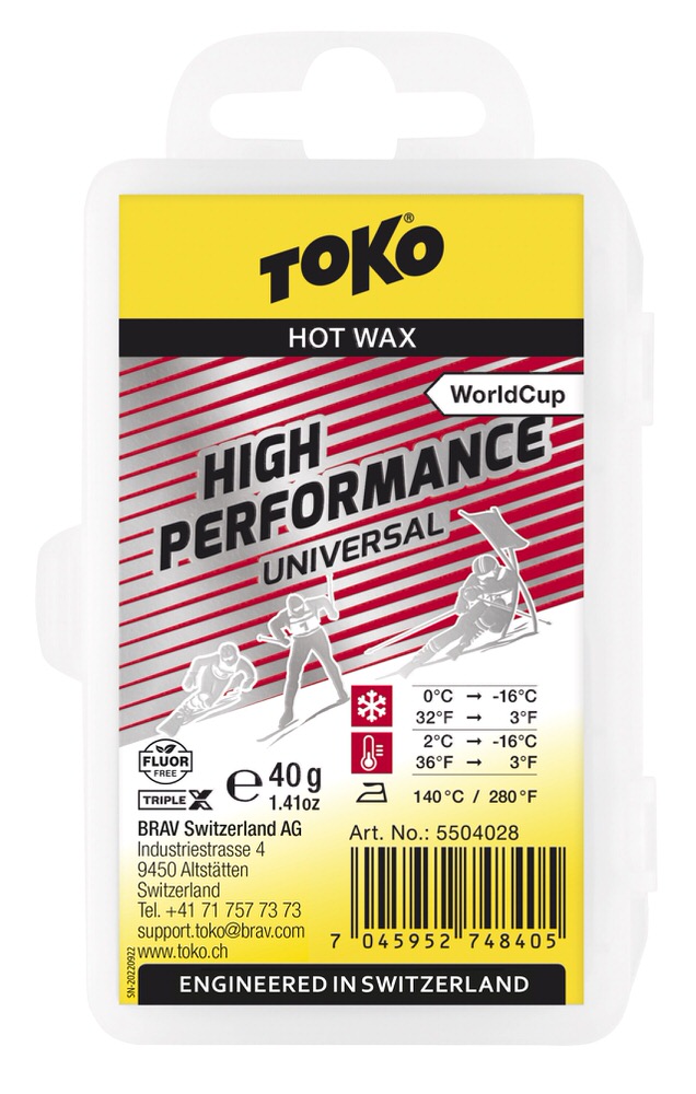 Verpackung des Toko High Performance Universal Hot Wax mit Temperaturangaben und Skifahrer-Illustrationen.